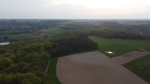 Camping spot besides a forest and farm lands during sunset. Stock Footage 194948931