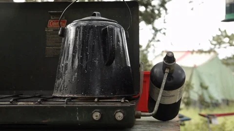 Camping stove heating coffee Stock Footage 104876621