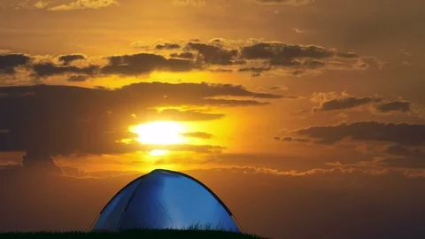 The camping tent against the background of sunset. Time lapse Stock Footage 72559031