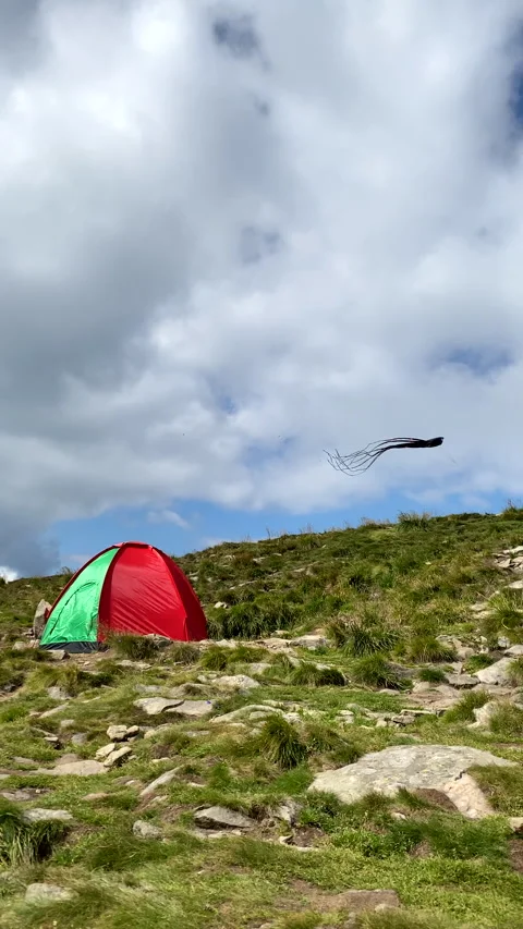 Camping tent on the mount kite on the wind on background Stock Footage 224690112