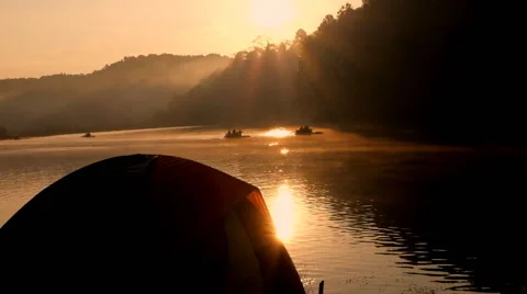 Camping tent near lake on the morning day Stock Footage