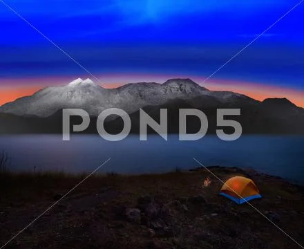 Camping tent with rock and snow mountian scene use for natural adventure jour Stock Photos