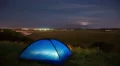 The camping tent by sunset (sunrise) and foggy above lake background 4k or 4k+ Resolution