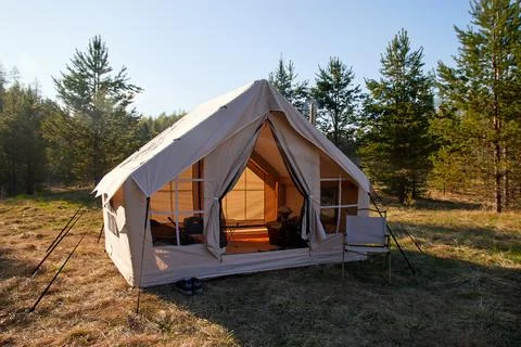 Camping tent under the pine forest. Inflatable tent Photos