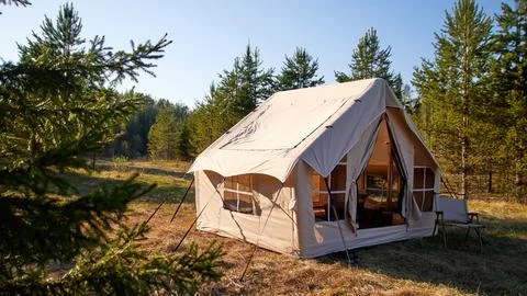 Camping tent under the pine forest. Inflatable tent Photos