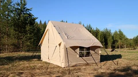 Camping tent under the pine forest. Inflatable tent Photos