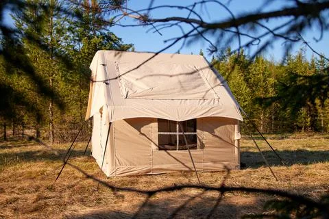 Camping tent under the pine forest. Inflatable tent Photos