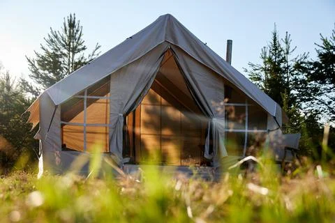 Camping tent under the pine forest. Inflatable tent Photos