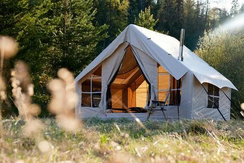 Camping tent under the pine forest. Inflatable tent Photos