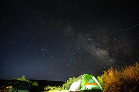 Camping under the starry night sky Stock Photos