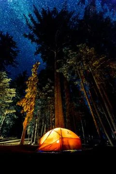 Camping under starry sky Stock Photos
