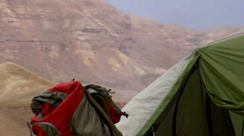 Campsite. Backpack on the ground next to the tent 3. Stock Footage 664377