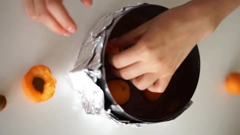 Can apricots in a cake mold Stock Footage 245685206