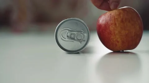 Can of lemonade and red apple Video stock 139044197