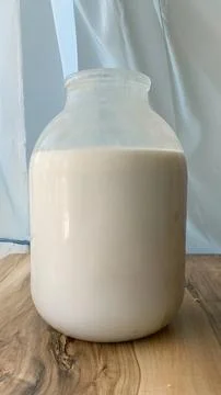A can of milk is on the table Stock Photos