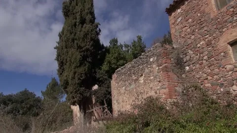 Can Robert fir tree stone old house gimbal La Mola bushes down Stock Footage 320547516