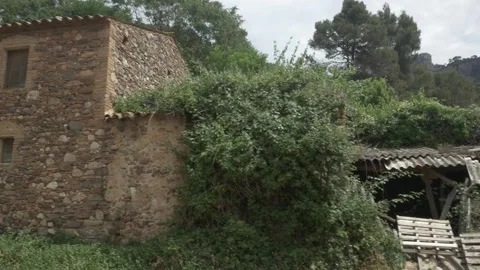 Can Robert old stone house gimbal traveling stabilized rural side close righ Stock Footage 321873983