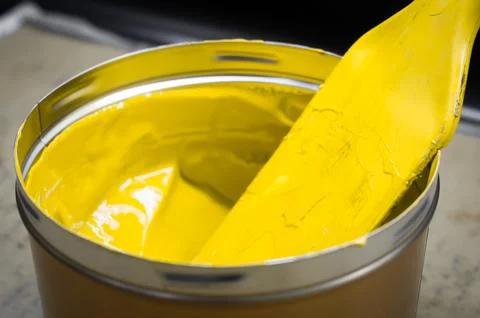 A can of yellow polygraph offset paint for the printing press. Special UV ink Stock Photos