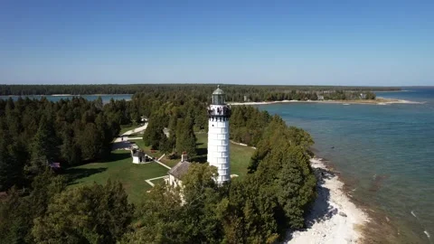 Cana Island Lighthouse Aerial Pull shot - Away from Island Stock Footage 323865222