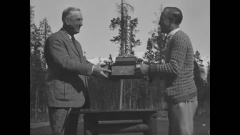 CANADA - 1920s - A man is presented with a tournament at a golf course. A car Stock Footage 327741181