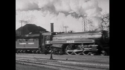 CANADA 1940s: Two communities separated by a waterway. Steam locomotive moves Stock Footage 313286468