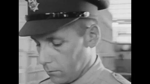 CANADA - 1965 - The chain of command is followed to report two inmates' escape Stock Footage 340649593