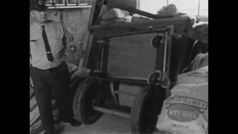 CANADA - 1965 - Prison guards conduct a thorough search of the grounds after two Stock Footage 340649614