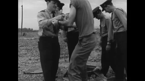 CANADA - 1965 - Two prisoners are transferred to a maximum security penitentiary Stock Footage 340649648