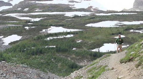 Canada Alberta Banff Eiffel Lake Trail hiker and snow patches 12 Stock Footage 40602650