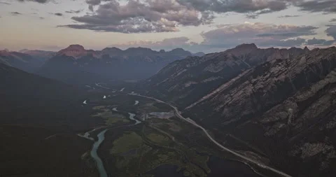 Canada Banff AB Aerial High Flyover Town Center Forest Valley Bow River Stock Footage 338263304