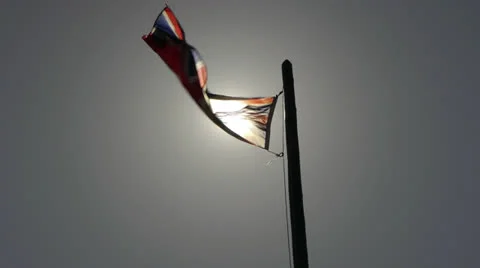 Canada, Banff, Waving Union Jack Flag w Sun Stock Footage 22705236