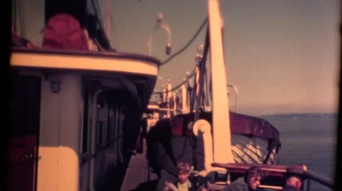 Canada, boy sitting on deck, freighter passing Stock Footage 54513871