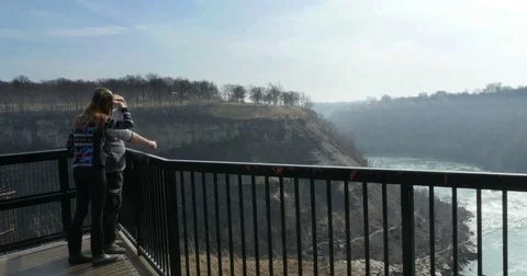CANADA FEB 2017 Couple Looking Pointing at Niagara River Editorial Stock Footage 73930897