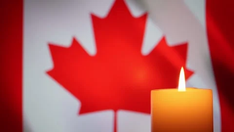 Canada flag and burning candle. Tragedy and mourning in the country. Stock Footage 254535754