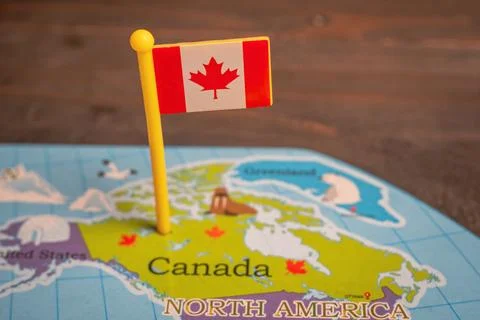 Canada flag pinned on a world map Stock Photos