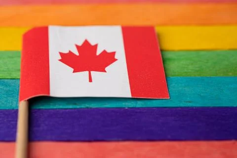 Canada flag on rainbow background symbol of LGBT gay pride month social mov.. Stock Photos