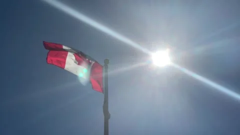 Canada Flag Sunlight beaming sunny day Stock Footage 280879256