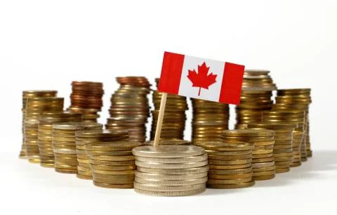 Canada flag waving with stack of money coins Stock Photos