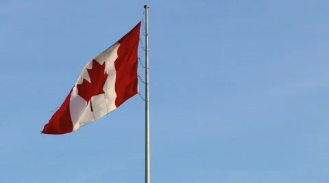 Canada Flag in Windy Blue Sky Left Justified (moving background) Video stock 555781