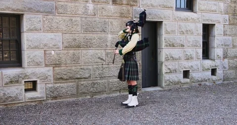 Canada Halifax, 1st September 2025: Bagpiper performing in traditional Scot.. Stock Footage 336750059