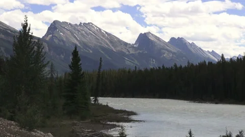 Canada Icefields Parkway Athabasca River with stark mountains s Stock Footage 39818434