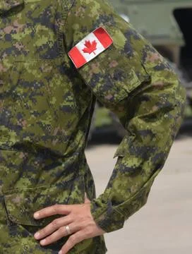 Canada patch flag on soldiers arm Stock Photos
