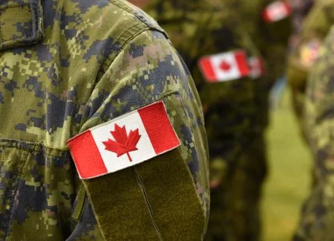 Canada patch flags on soldiers arm. Canadian troops Stock Photos