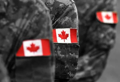 Canada patch flags on soldiers arm. Canadian troops Stockfoto's