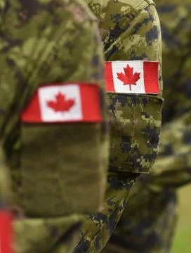 Canada patch flags on soldiers arm. Canadian troops Fotos de archivo