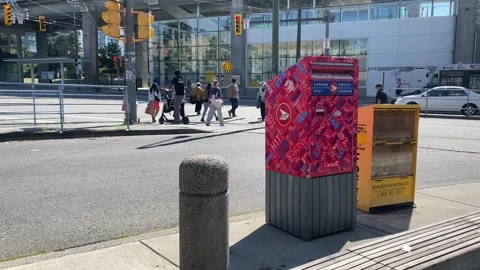 Canada Post Mailbox with Anonymous Pedestrians Stock Footage 282061131