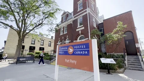Canada post sign post infront of post office port perry Stock Footage 260878808