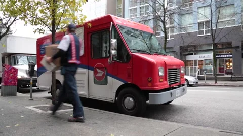 Canada postman carrying box toward car Stock-Footage 57787080