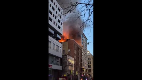 Canada: Rooftop Fire Breaks Out in Downtown Toronto After Possible Propan... Stock Footage 331613400