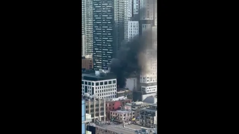 Canada: Rooftop Fire Breaks Out in Downtown Toronto After Possible Propan... Stock Footage 331615874